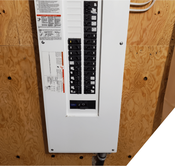 Electrical Panel Upgrades shown in a detailed view of a circuit breaker panel board with various switches and electrical connections