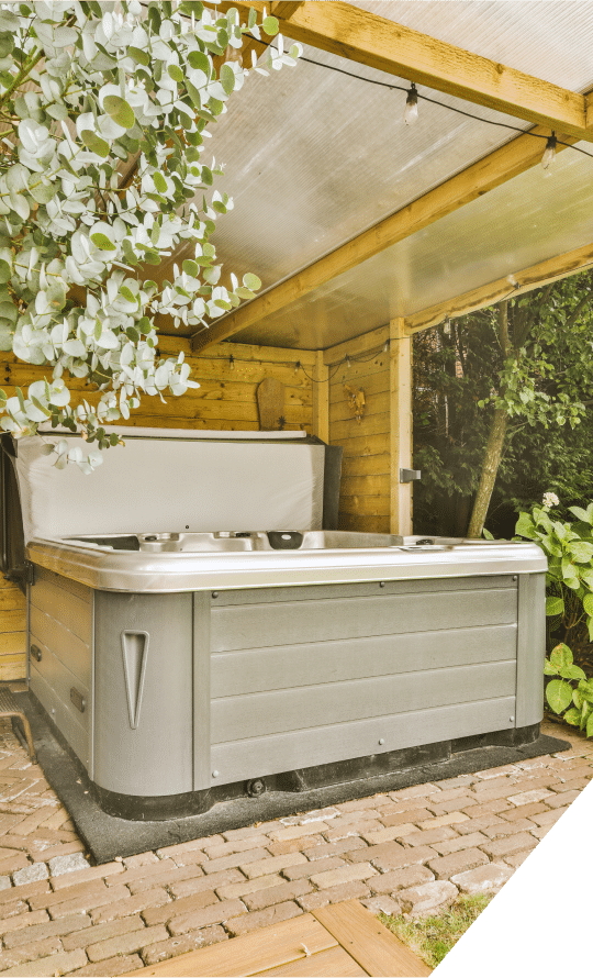 Heat Pump Installation near a pristine, empty hot tub in a serene outdoor setting, inviting relaxation and tranquility