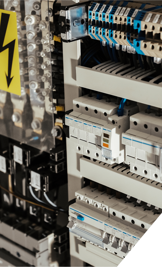 An electric panel board displaying various circuit breakers and electrical components for power distribution