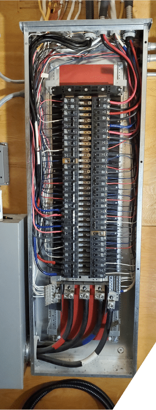 A close-up view of electric wires neatly arranged inside a junction box, showcasing their connections and insulation